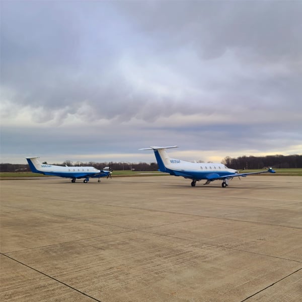 Two business jets parked on the ramp at Michigan City Municipal Airport