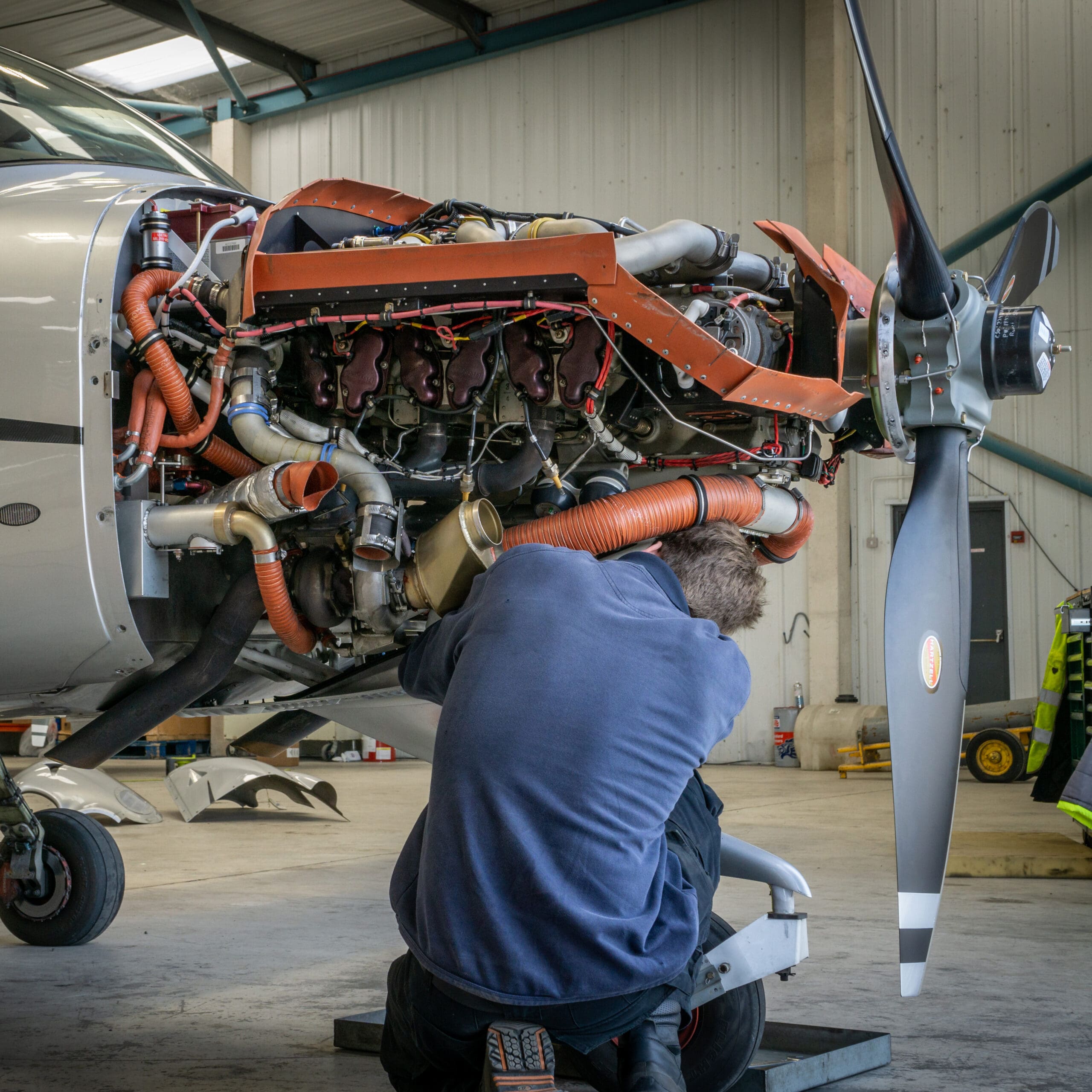 Aircraft engine maintenance inside a hangar at Michigan City Municipal Airport Aircraft engine maintenance inside a hangar at Michigan City Municipal Airport